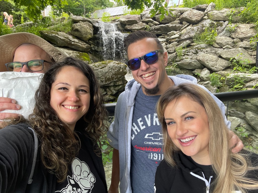 Family photo in front of a waterfall at Grandfather Mountain in North Carolina.