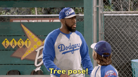 Junior baseball team joins together in a tree pose in this clip from a sitcom
